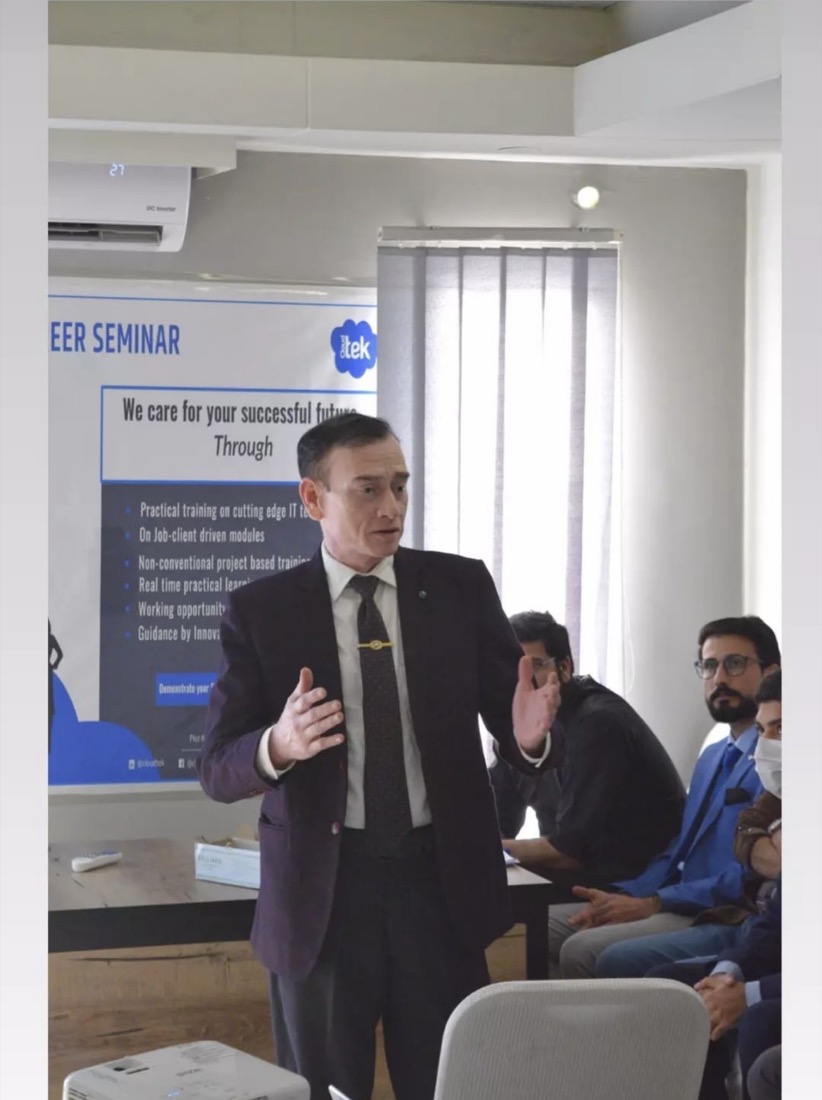 A speaker and participants at a Cloudtek technology career seminar